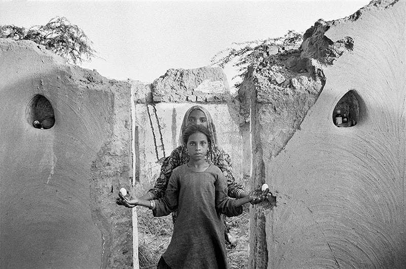 Karina and Nimli, in a home destroyed by flooding, Lunkaransar