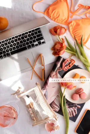 Orange Bikini, Laptop & Tulips. Stock Photo