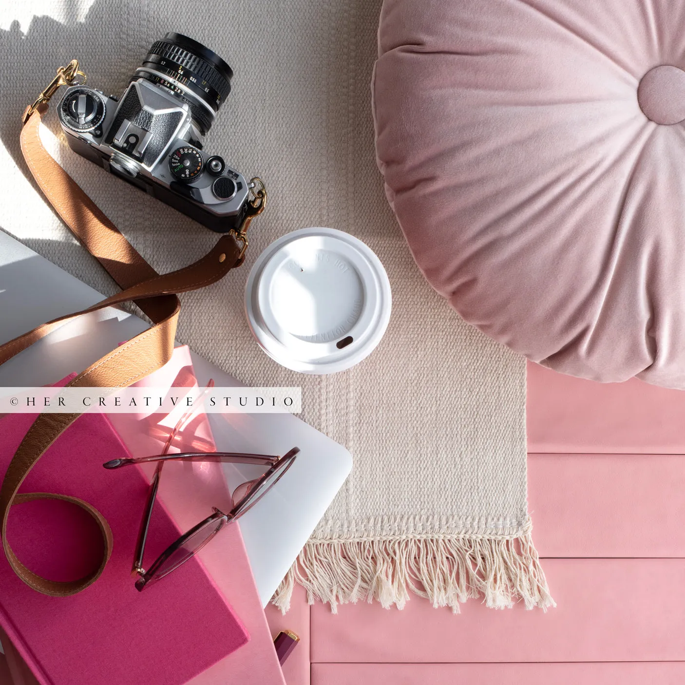 Pink Notebook, Camera on Pink Background. Stock Photo